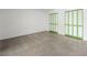 An open bedroom with cement floors and bi-fold doors at 2245 Sombrero Dr, Las Vegas, NV 89169