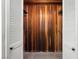 Wood-paneled closet featuring a white louvered door at 2245 Sombrero Dr, Las Vegas, NV 89169