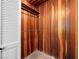 Wood-paneled closet featuring a clothing rod at 2245 Sombrero Dr, Las Vegas, NV 89169