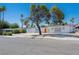 Well-maintained single-story home with a manicured front yard, and a distinctive orange front door at 2245 Sombrero Dr, Las Vegas, NV 89169
