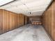 Spacious garage with wood paneling and ample storage space ready for your vehicles and projects at 2245 Sombrero Dr, Las Vegas, NV 89169
