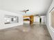 Bright living room with concrete floors, a view into the kitchen, and large windows offering ample natural light at 2245 Sombrero Dr, Las Vegas, NV 89169