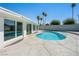 Inviting pool with blue water, concrete patio, and palm trees in a well-maintained backyard at 2245 Sombrero Dr, Las Vegas, NV 89169