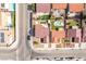An aerial view of the home shows the xeriscaped backyard with covered patio and synthetic grass at 2403 Sexton Ave, North Las Vegas, NV 89031