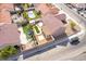 Stunning aerial view of a backyard oasis featuring a pool, lush landscaping, and a private outdoor living space at 2403 Sexton Ave, North Las Vegas, NV 89031