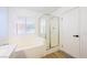 Bathroom featuring a tub and glass shower with a window at 2403 Sexton Ave, North Las Vegas, NV 89031