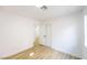 Bedroom with wood-look floors, walk-in closet and window at 2403 Sexton Ave, North Las Vegas, NV 89031