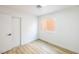 Simple bedroom with ample light and wood-look flooring and closet at 2403 Sexton Ave, North Las Vegas, NV 89031