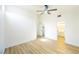 Bedroom featuring wood floors, ceiling fan, and a partial ensuite view at 2403 Sexton Ave, North Las Vegas, NV 89031