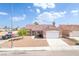 Charming single-story home with a well-maintained front yard and a two-car garage at 2403 Sexton Ave, North Las Vegas, NV 89031