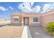 Inviting front entrance with pathway and xeriscaped yard, showcasing the home's curb appeal at 2403 Sexton Ave, North Las Vegas, NV 89031