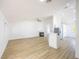 Spacious living area featuring a fireplace, seamlessly connected to the modern kitchen at 2403 Sexton Ave, North Las Vegas, NV 89031
