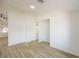 Open-concept living room with wood-look flooring and ample light at 2403 Sexton Ave, North Las Vegas, NV 89031