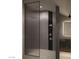 Stylish bathroom featuring a glass-enclosed shower and built-in shelves with toiletries at 2935 Montessouri St, Las Vegas, NV 89117