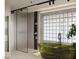 Modern bathroom with a unique glass enclosed shower, tub, and stylish tile work at 2935 Montessouri St, Las Vegas, NV 89117