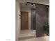 Elegant bathroom showcasing a glass shower enclosure, a wood door, and a luxurious feel at 2935 Montessouri St, Las Vegas, NV 89117