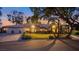 Inviting single-story home featuring manicured landscaping, a tile roof, and an attached two-car garage at 2935 Montessouri St, Las Vegas, NV 89117