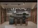 Spacious kitchen with a kitchen island featuring green countertops, modern appliances, and sleek cabinetry at 2935 Montessouri St, Las Vegas, NV 89117