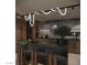 Modern kitchen featuring green island countertops, a sleek design, and high-end appliances at 2935 Montessouri St, Las Vegas, NV 89117