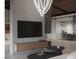 Bright living room featuring a sleek entertainment center, modern lighting, and stylish decor at 2935 Montessouri St, Las Vegas, NV 89117