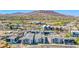 Wide aerial view of a modern community with surrounding mountains and cityscape at 31 Newport Edge Pl, Henderson, NV 89015