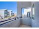 Balcony view of street with modern townhomes and sleek black railings at 31 Newport Edge Pl, Henderson, NV 89015