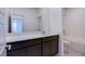 Bathroom with a vanity, large mirror, tub-shower combo with tiled walls, and toilet at 31 Newport Edge Pl, Henderson, NV 89015