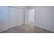 Clean and well-lit bedroom with plush carpeting and a spacious closet at 31 Newport Edge Pl, Henderson, NV 89015