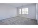 Bright bedroom with neutral carpet and dual windows at 31 Newport Edge Pl, Henderson, NV 89015