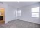 Bright bedroom with neutral carpet, closet, and natural light at 31 Newport Edge Pl, Henderson, NV 89015