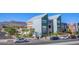 Modern building with colorful murals, landscaping, and street parking at 31 Newport Edge Pl, Henderson, NV 89015