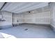 Spacious two-car garage with concrete flooring and overhead door at 31 Newport Edge Pl, Henderson, NV 89015