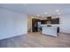 Open floor plan showcasing kitchen with quartz island and stainless steel appliances at 31 Newport Edge Pl, Henderson, NV 89015