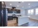 Bright kitchen with stainless steel appliances and island providing ample counter space at 31 Newport Edge Pl, Henderson, NV 89015