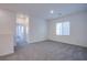 Spacious carpeted living room with recessed lighting and a large window at 31 Newport Edge Pl, Henderson, NV 89015