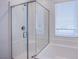 Modern shower with a glass door and white subway tile at 31 Newport Edge Pl, Henderson, NV 89015