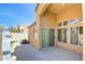 A concrete patio with water feature, sliding glass door and an air conditioning unit at 3429 Glacial Lake St, Las Vegas, NV 89122