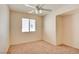 Bedroom featuring neutral carpet, ceiling fan, and window at 3429 Glacial Lake St, Las Vegas, NV 89122