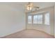 Bright bedroom featuring carpet flooring, a ceiling fan, and bright natural light from the windows at 3429 Glacial Lake St, Las Vegas, NV 89122
