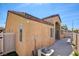 Tan stucco home with an arched covered patio and well maintained landscaping at 3429 Glacial Lake St, Las Vegas, NV 89122