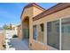 Tan stucco exterior with windows, sliding door and concrete patio at 3429 Glacial Lake St, Las Vegas, NV 89122