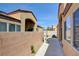 A view of the home's side yard, patio, and water feature at 3429 Glacial Lake St, Las Vegas, NV 89122