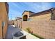 A view of the home's side yard and concrete patio at 3429 Glacial Lake St, Las Vegas, NV 89122