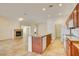 Open kitchen featuring an island with granite countertops and a breakfast bar at 3429 Glacial Lake St, Las Vegas, NV 89122