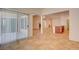 Spacious living room featuring tile flooring, bright natural light, and access to the kitchen at 3429 Glacial Lake St, Las Vegas, NV 89122