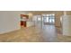 Spacious living area with tile flooring, fireplace, and seamless flow to the kitchen at 3429 Glacial Lake St, Las Vegas, NV 89122