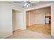 Open-concept living room featuring neutral carpet and tile floor at 3429 Glacial Lake St, Las Vegas, NV 89122