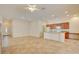 Open floor plan with tile flooring, kitchen island, and natural light from the windows at 3429 Glacial Lake St, Las Vegas, NV 89122