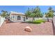 Spacious backyard featuring desert landscaping with an ample artificial lawn at 3693 Miguels Ln, Las Vegas, NV 89120