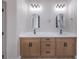 Bathroom with dual vanities, quartz countertops, and wood cabinetry at 3693 Miguels Ln, Las Vegas, NV 89120